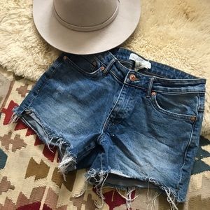Distressed denim cutoff shorts